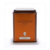 Boîte métallique vide « Rooibos » Dammann Frères, capacité 100 g, couvercle hermétique, décor orange-rouge, prête à accueillir une infusion sans théine.