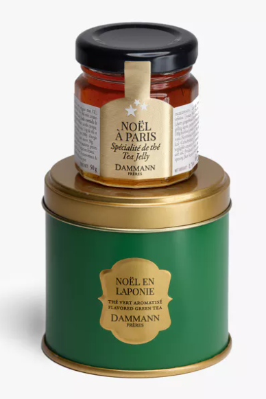 Coffret cadeau Dammann Frères « Noël en Laponie » avec thé vert en boîte métal et pot gourmand, présenté dans une pochette au décor hivernal.