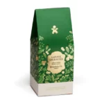 Coffret cadeau Dammann Frères « Noël en Laponie » avec thé vert en boîte métal et pot gourmand, présenté dans une pochette au décor hivernal.