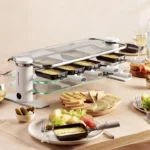 Appareil à raclette Transparence 10 personnes Lagrange sur table – design en verre trempé et poêlons noirs